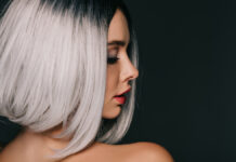 A-Line Amber Bob – Best Haircuts for Medium Length Hair Beautiful woman modeling a sharp a-line bob haircut in a rich warm amber color.
