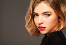 The Ultimate Guide to Bob Haircuts: That Never Go Out of Style Stunning woman modeling a precision laser-line short bob haircut in a luxury salon.