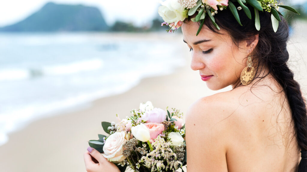 Breathtaking bride with soft champagne blonde hair wearing an ethereal gravity-defying wedding updo.