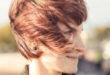 Chic Short Hairstyles – That Will Elevate Your Look Fashionable woman modeling a chic short hairstyle with refined texture and luxury shine.