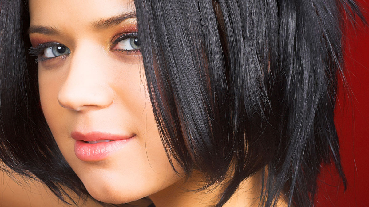 Elegant short haircut featuring a crisp wispy bob with soft textured layers.