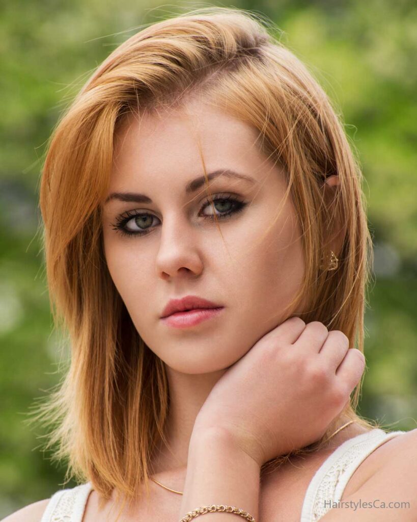 Blunt shoulder-length bob with soft waves and a middle part