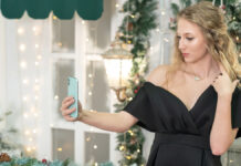 How to Style Your Hair on Holiday Without the Hassle Woman with effortless humidity-defying beach waves perfect for summer holiday hairstyles.
