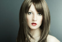 Long Layered Hairstyles: Your Complete Guide to Effortless Volume Woman showcasing ultra-long cascading layers and high-gloss texture for long hairstyles.