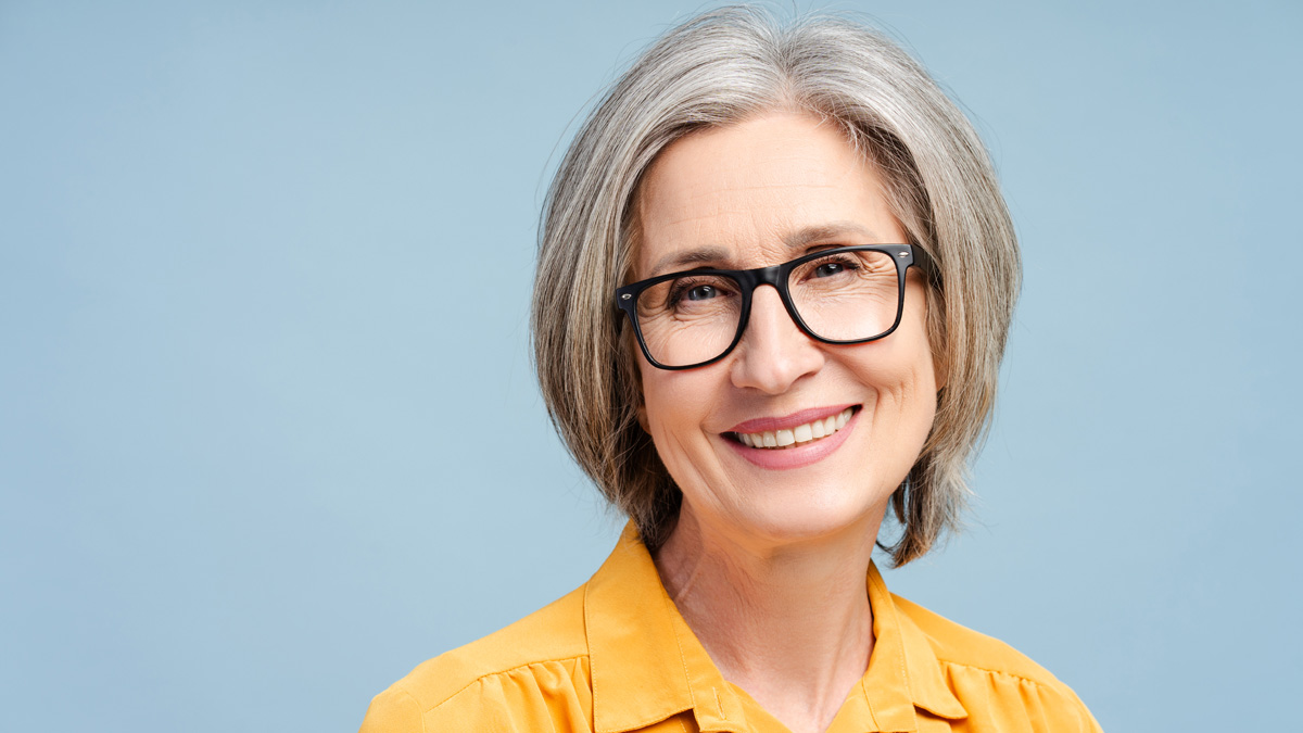 Confident woman over 60 rocking a low-maintenance and highly textured short haircut.